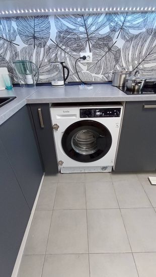 Установка и подключение встраиваемой стиральной машины