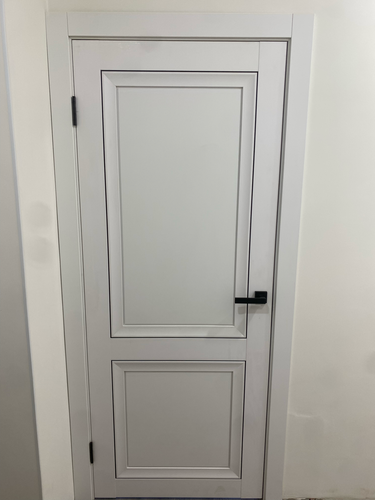 Отделка откосов входной двери (оштукатуривание или установка панелей)