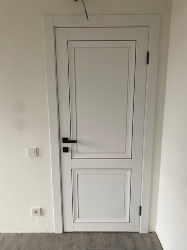 Отделка откосов входной двери (оштукатуривание или установка панелей)