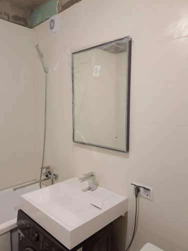 Сборка и навеска зеркального шкафа в ванной комнате